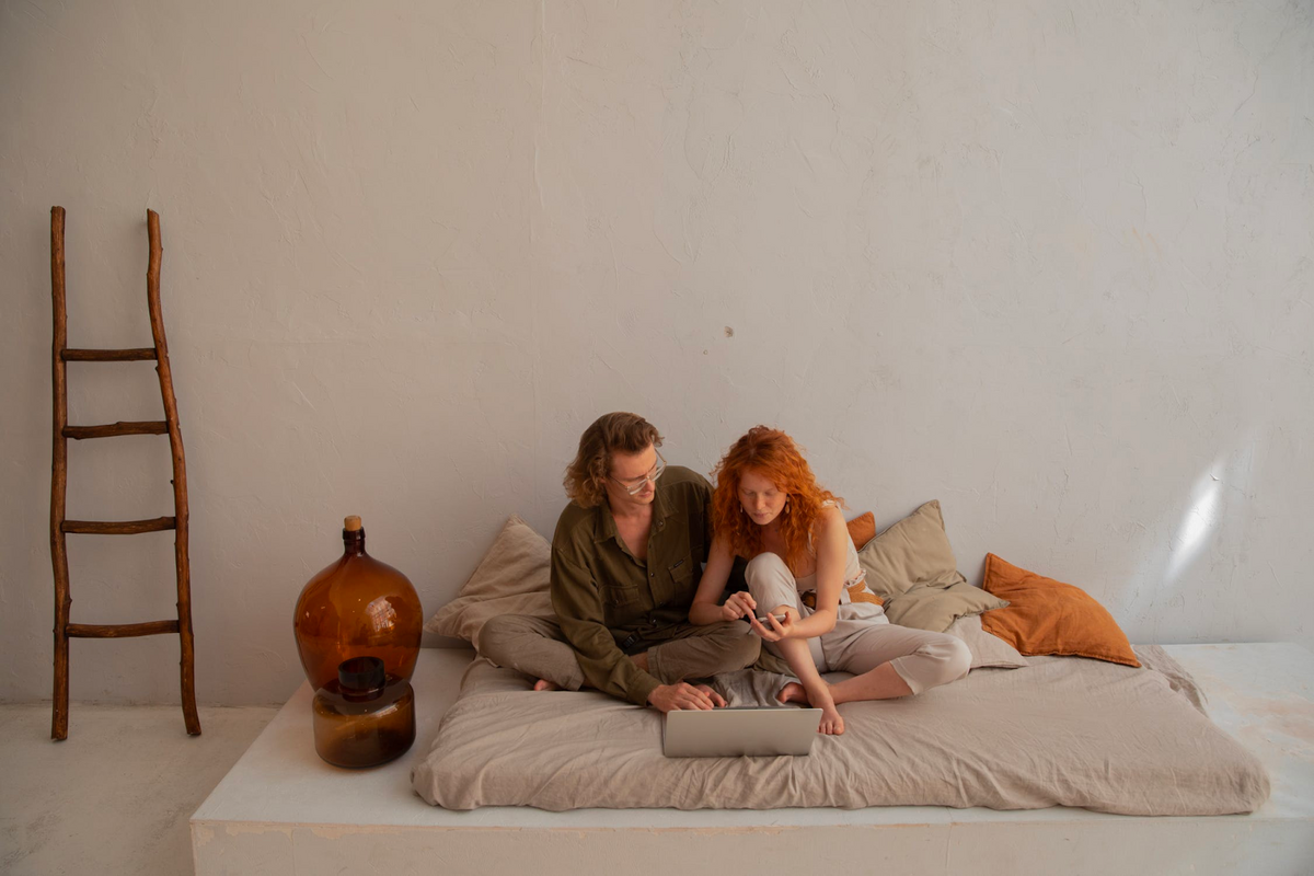 futon mattress on floor with couple on it