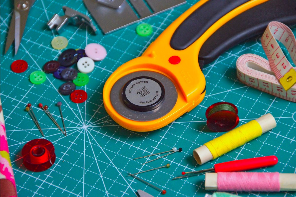 rotary cutter, buttons, pins and more for making futon mattress