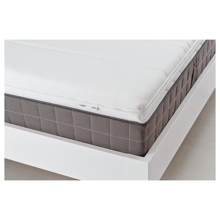 white mattress with brown accent underneath
