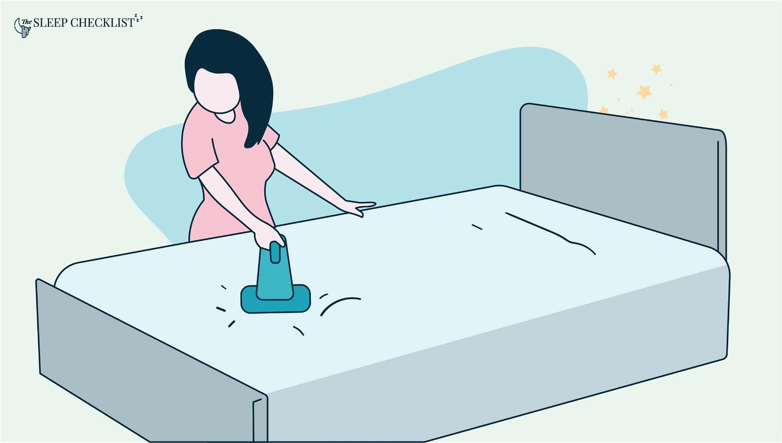 handheld vacuum being used on mattress